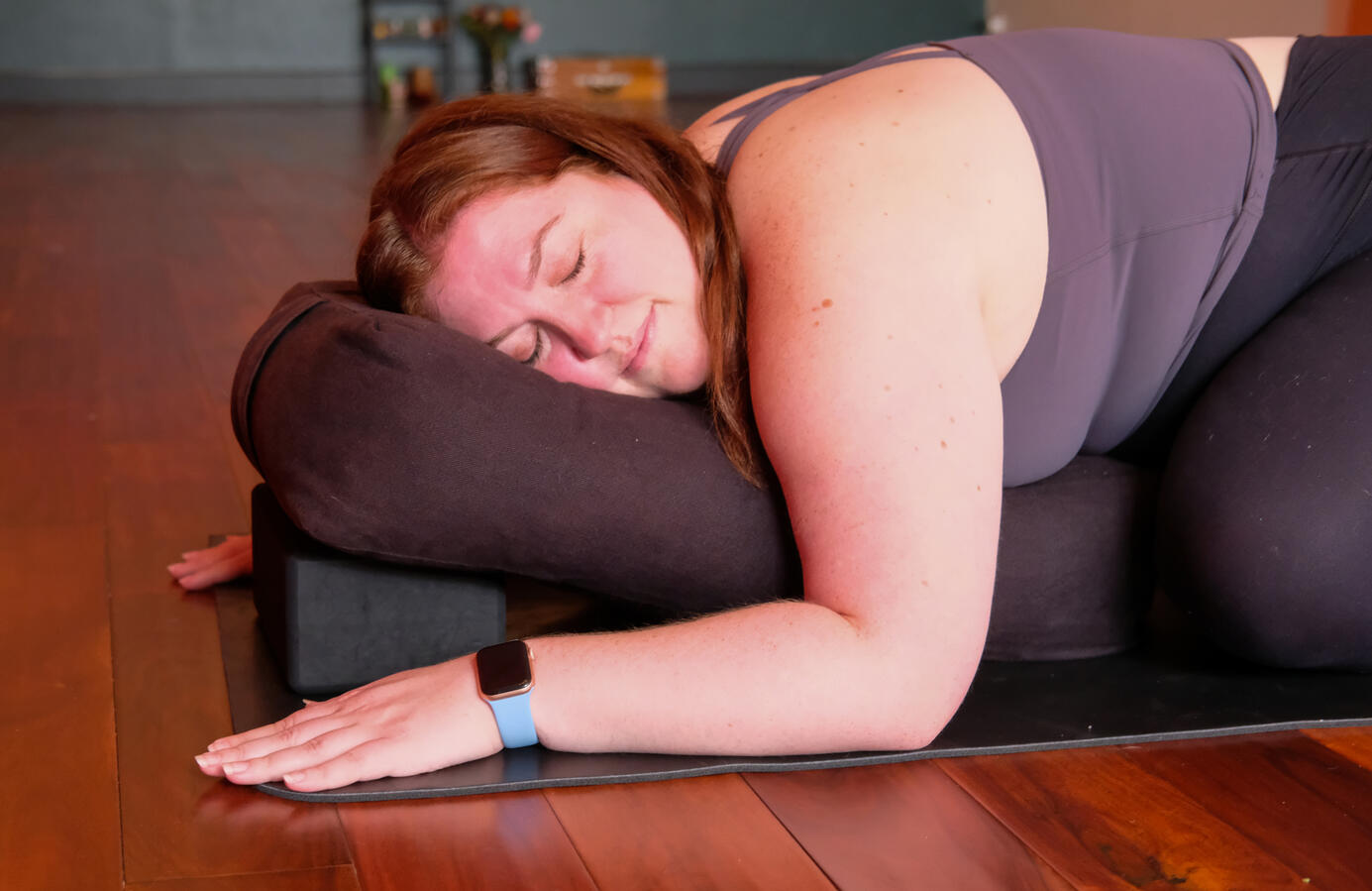 Steph lying on bolster with eyes closed