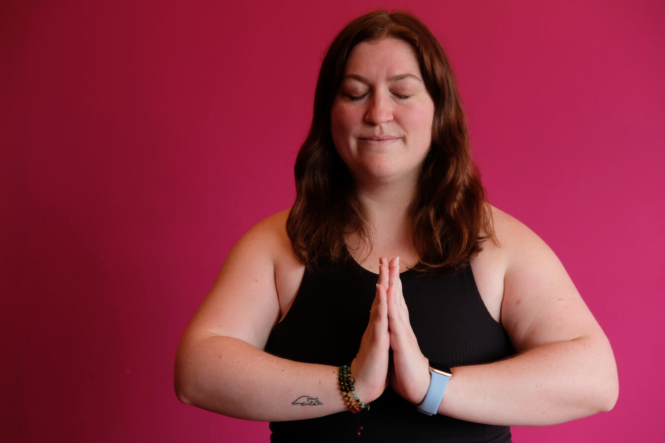 Steph with hands in prayer